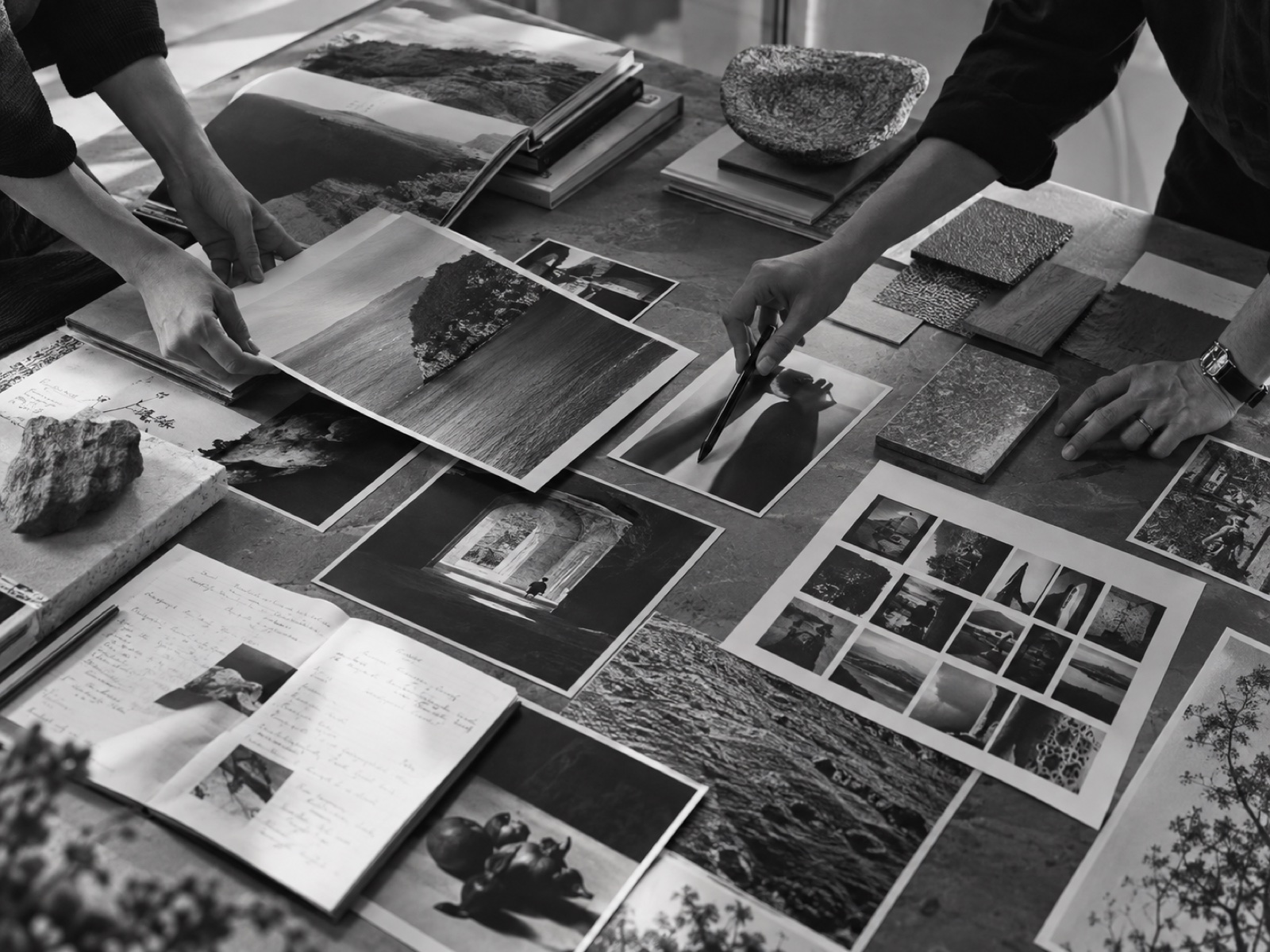 Teams examining photography, notes and material references during brand discovery
