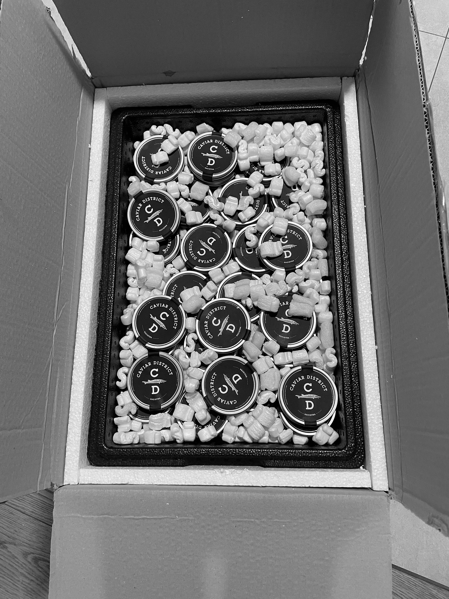 Caviar District tins in a monochrome shipment